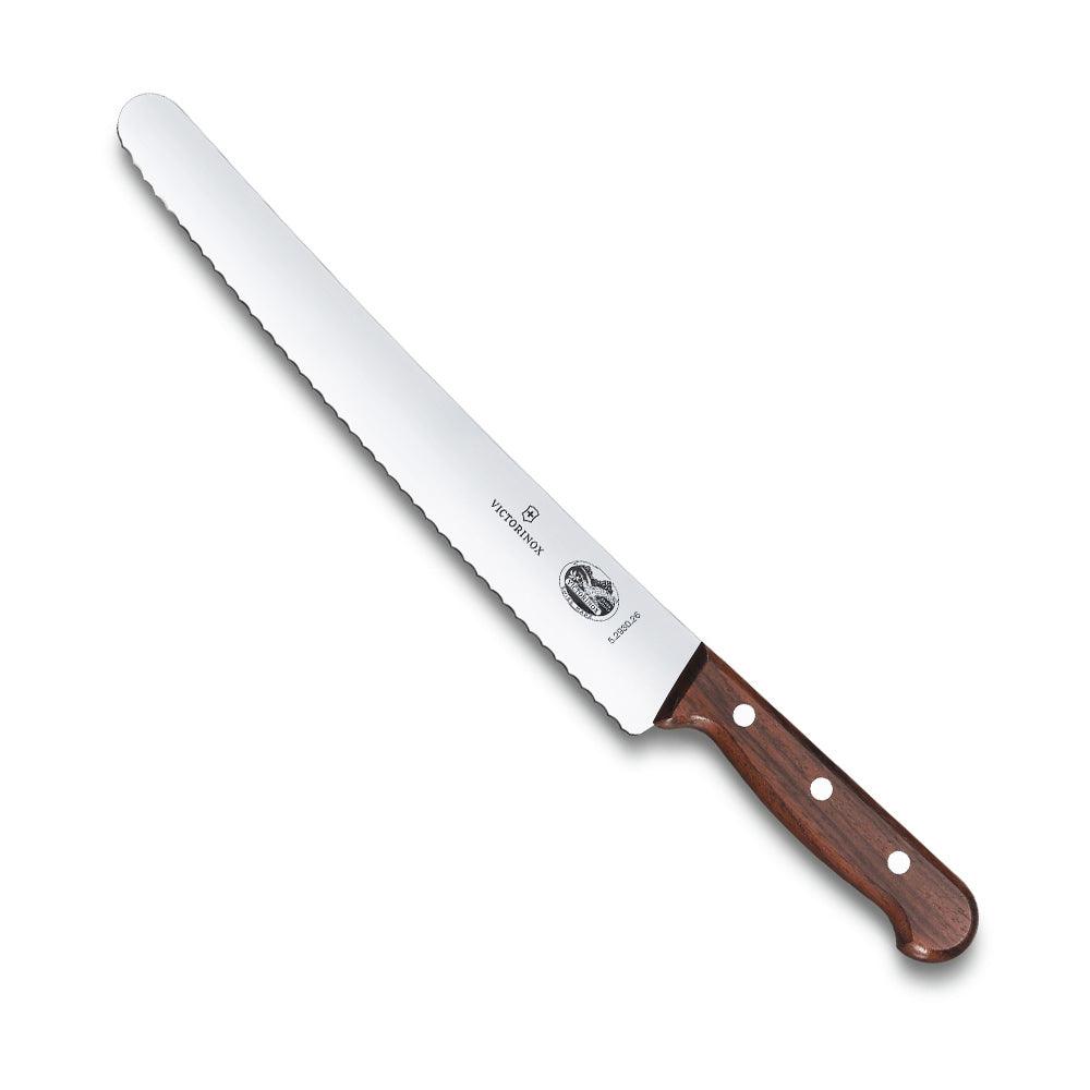 Victorinox Pastry Knife - 26cm - Wood Handle with a long silver wavy-edge blade and a polished brown wooden handle.