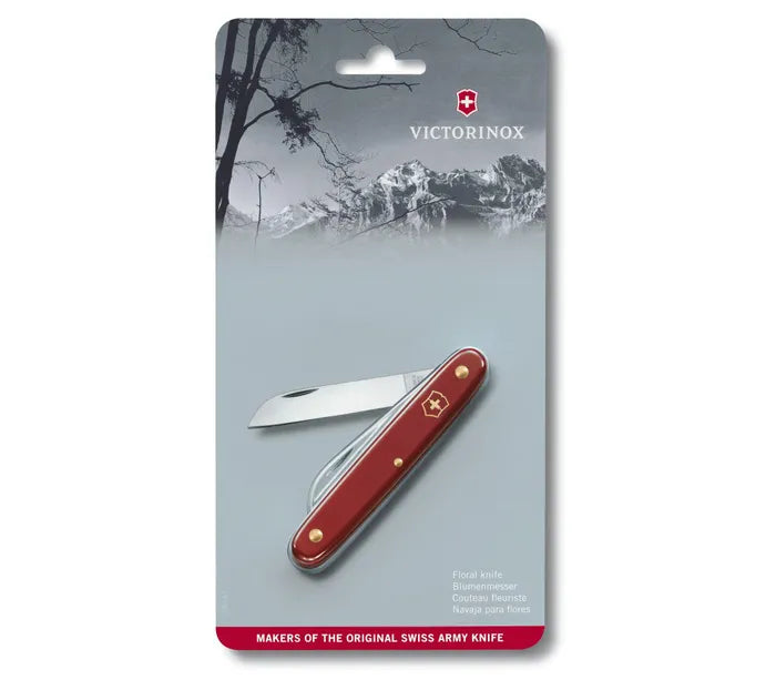 Victorinox Red Pocket Knife with a red handle, polished metal edges, and a straight silver blade in blister packaging
