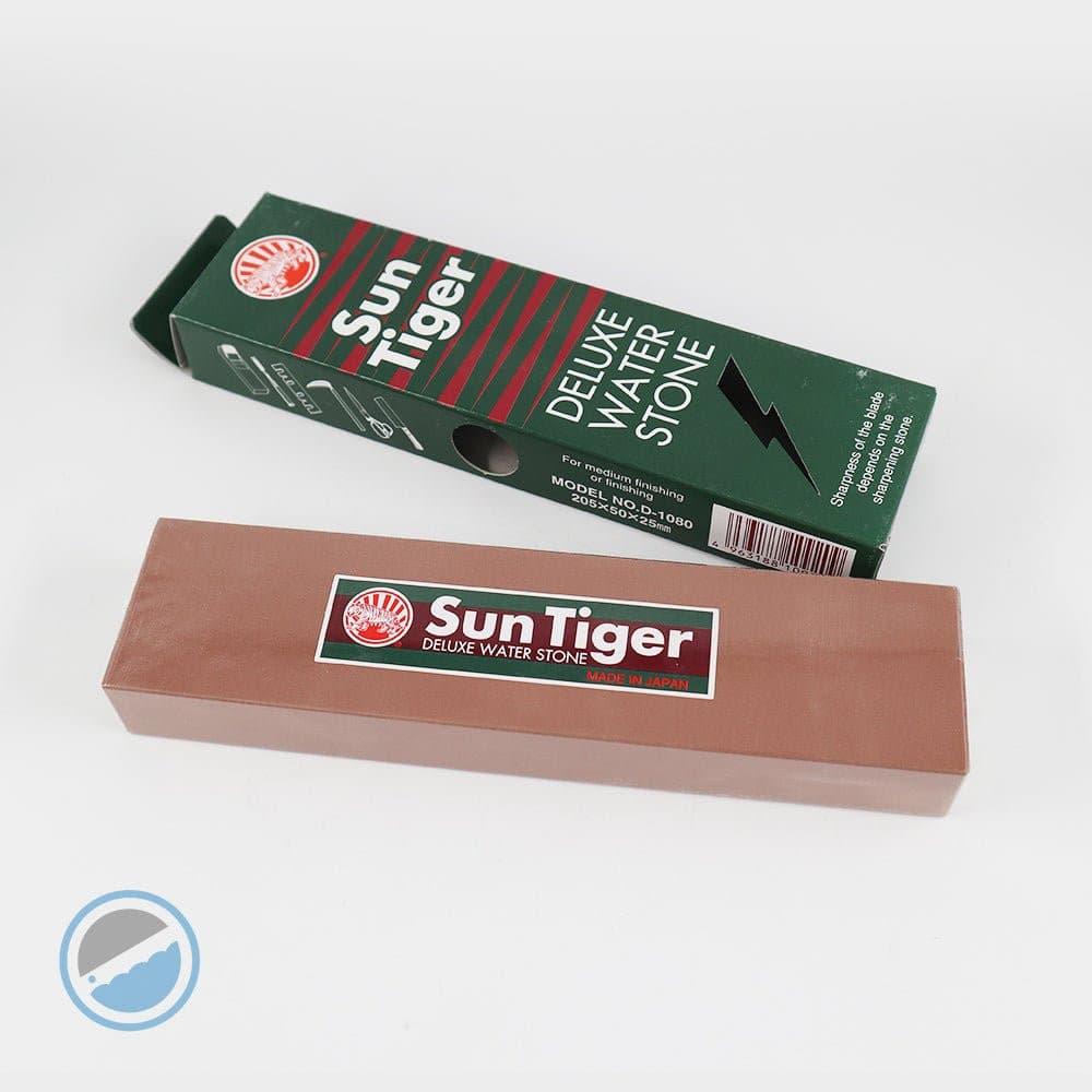Sun Tiger - Bench Stone Water # sharpening stone in muted pink with a smooth rectangular surface and branded label