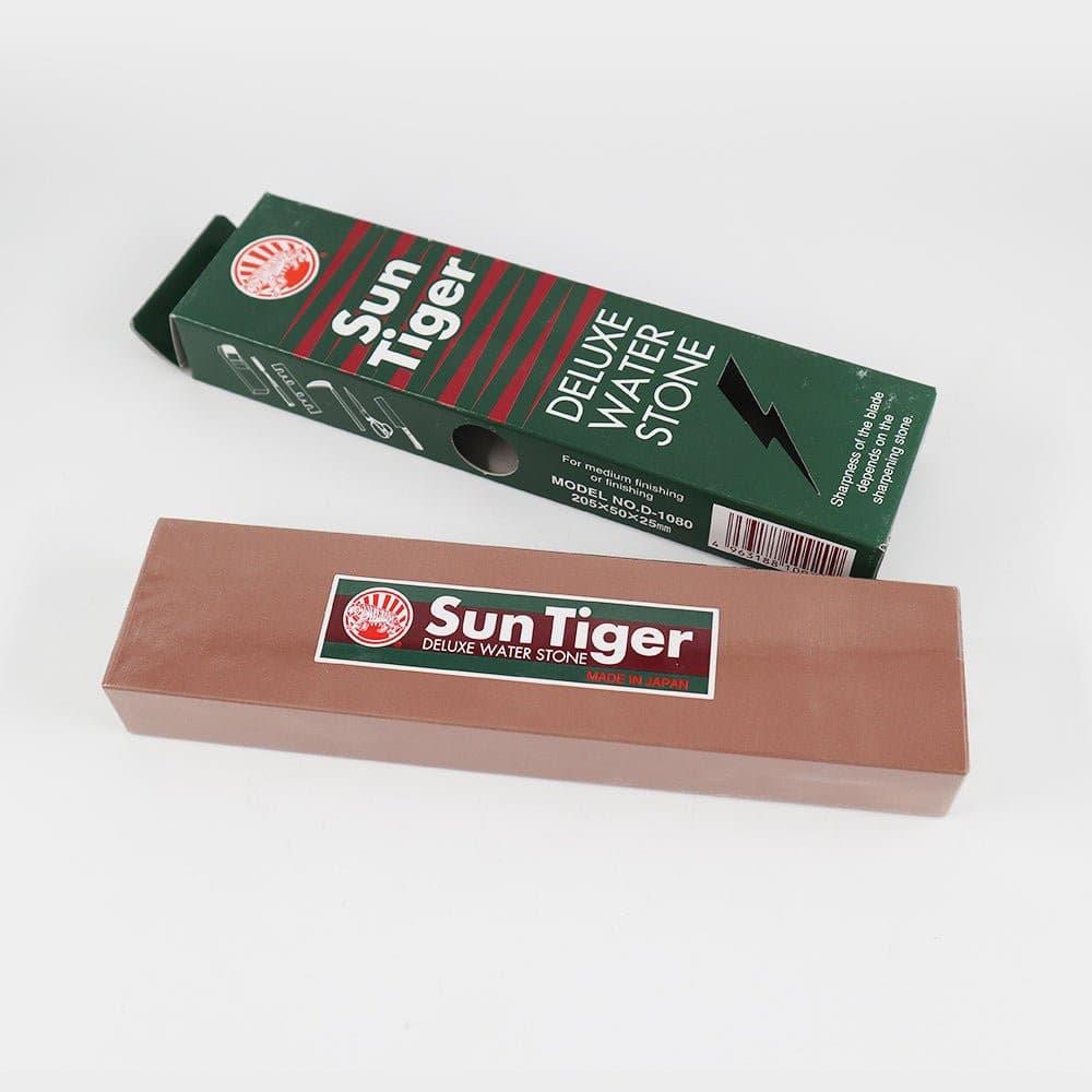 Water sharpening stone, Sun Tiger - Bench Stone Water #, terracotta-colored rectangular stone with a branded label and green striped box.